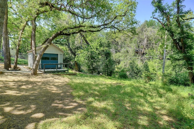 view of yard with a view of trees