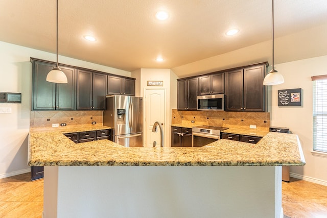 kitchen featuring baseboards, light stone counters, tasteful backsplash, and stainless steel appliances