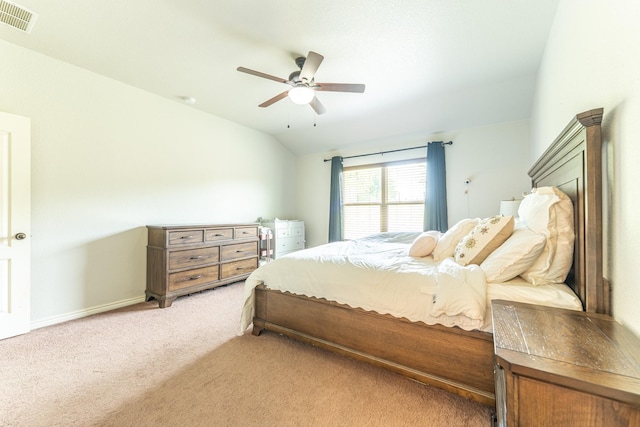 bedroom featuring vaulted ceiling, ceiling fan, light colored carpet, baseboards, and visible vents