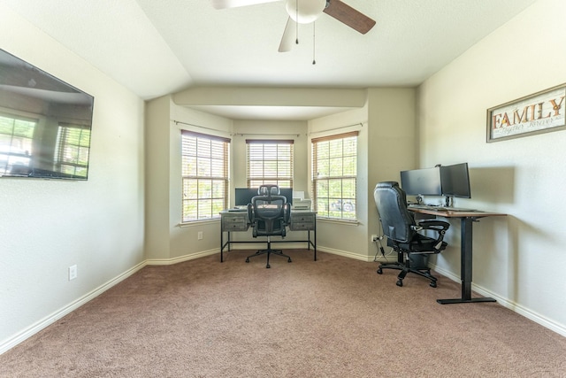 office area with carpet flooring, baseboards, and a ceiling fan