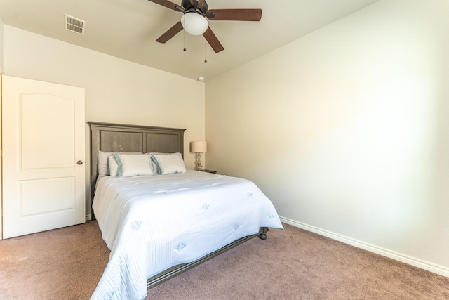 bedroom with ceiling fan, visible vents, baseboards, and light carpet