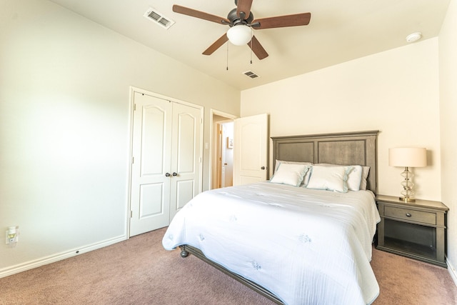bedroom featuring a closet, visible vents, and carpet flooring
