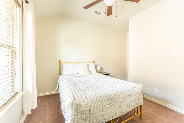 bedroom featuring vaulted ceiling, visible vents, carpet flooring, and baseboards