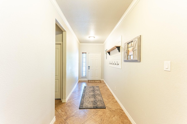 interior space featuring baseboards, light tile patterned floors, and crown molding