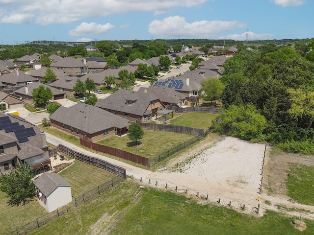 birds eye view of property with a residential view