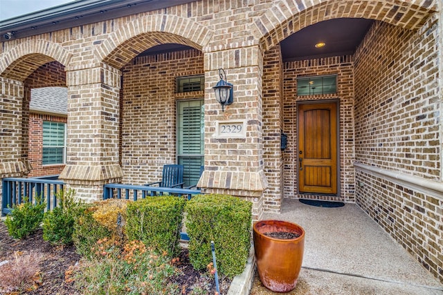 entrance to property with brick siding