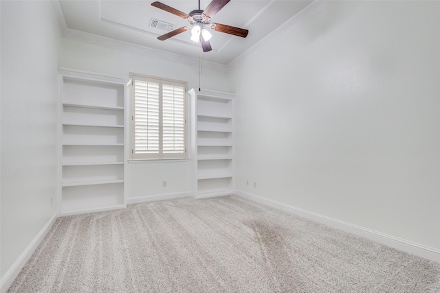 unfurnished bedroom featuring baseboards, visible vents, carpet floors, and ornamental molding
