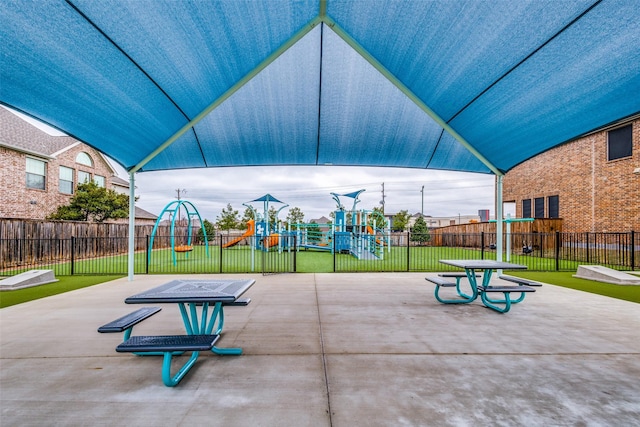 view of play area featuring fence and a yard