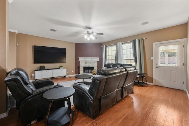 1603 Willow Ln, Cedar Hill, TX 75104 - living room featuring a fireplace, light wood-style floors, a ceiling fan, visible vents, and baseboards