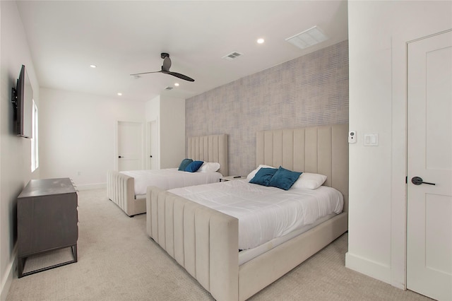 bedroom with recessed lighting, light carpet, visible vents, and baseboards