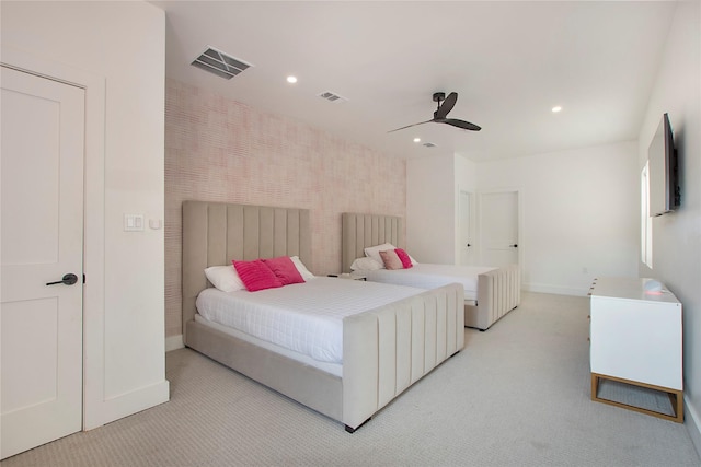 bedroom featuring visible vents, baseboards, recessed lighting, and light colored carpet