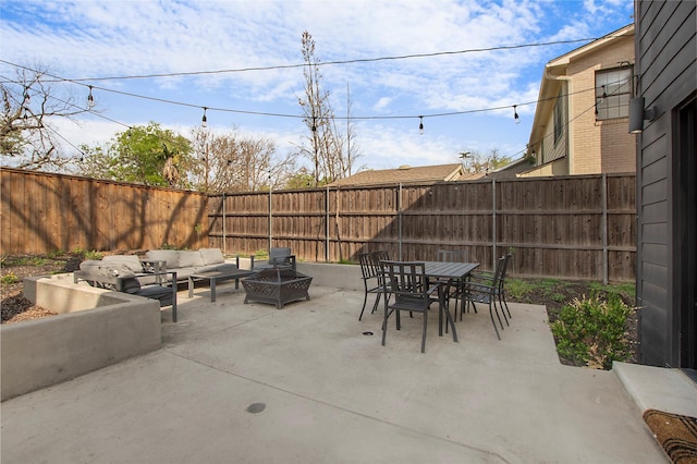 view of patio / terrace featuring a fenced backyard, outdoor lounge area, and outdoor dining space