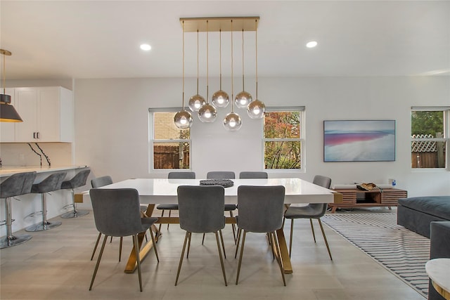 dining room with recessed lighting