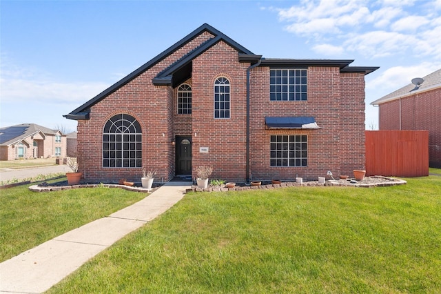 7022 Cottonwood Cir, Sachse, TX 75048 - traditional home featuring brick siding, a front lawn, and fence