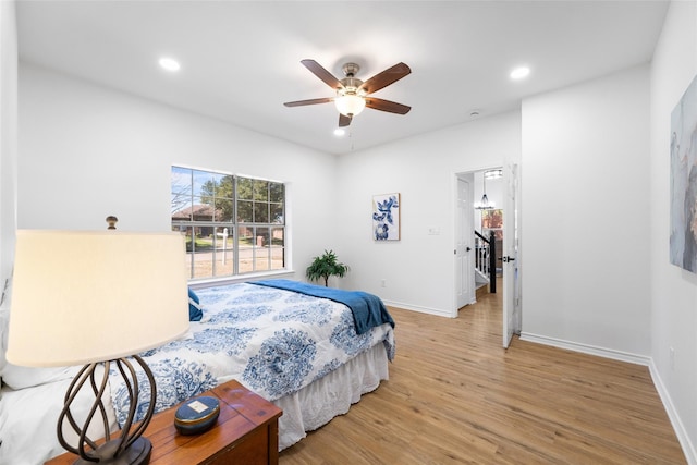 7022 Cottonwood Cir, Sachse, TX 75048 - bedroom featuring recessed lighting, light wood-type flooring, and multiple windows
