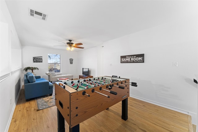 7022 Cottonwood Cir, Sachse, TX 75048 - playroom with light wood-type flooring, baseboards, visible vents, and ceiling fan