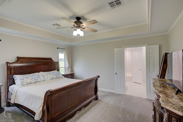 bedroom with light carpet, ornamental molding, visible vents, and a raised ceiling