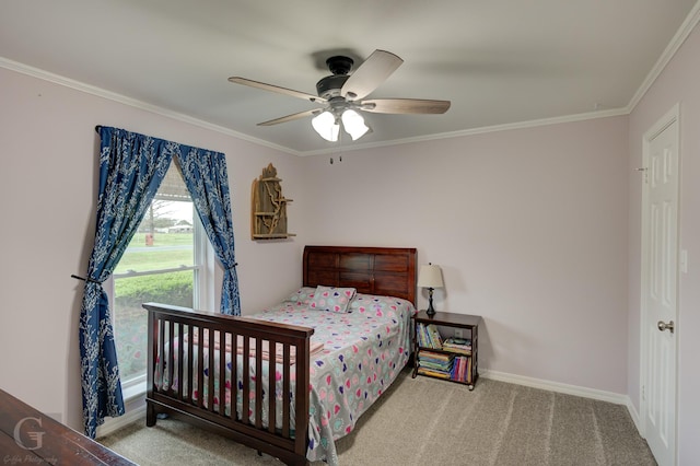 bedroom featuring baseboards, carpet floors, ceiling fan, and ornamental molding
