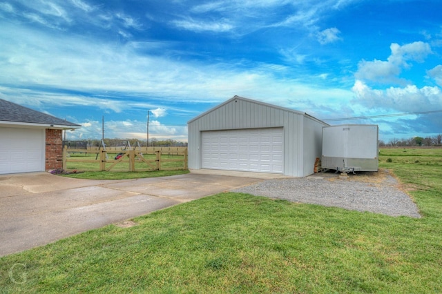 detached garage featuring fence