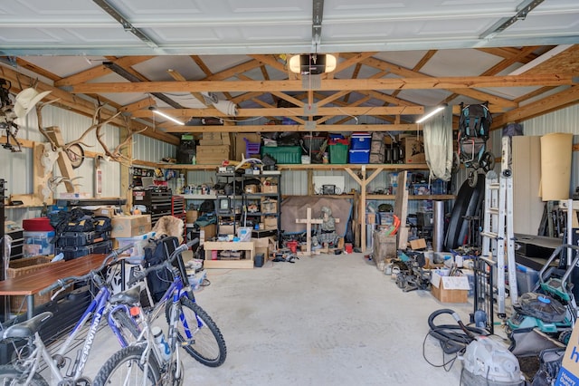 garage with a workshop area and a garage door opener
