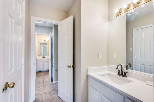 2311 Megan Way, Arlington, TX 76016 - bathroom with tile patterned floors and two vanities