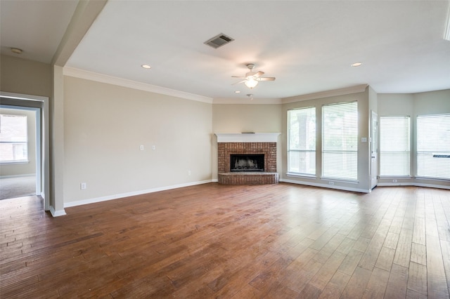 2311 Megan Way, Arlington, TX 76016 - unfurnished living room with ceiling fan, healthy amount of natural light, dark wood-type flooring, baseboards, and ornamental molding