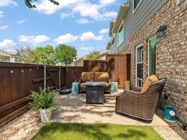 view of patio with a fenced backyard and outdoor lounge area