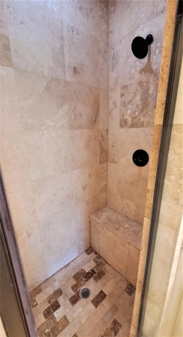 full bathroom with tiled shower