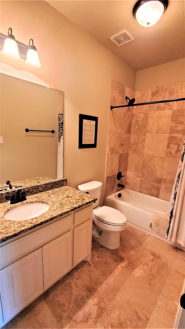 full bathroom featuring shower / bath combo, visible vents, vanity, and toilet
