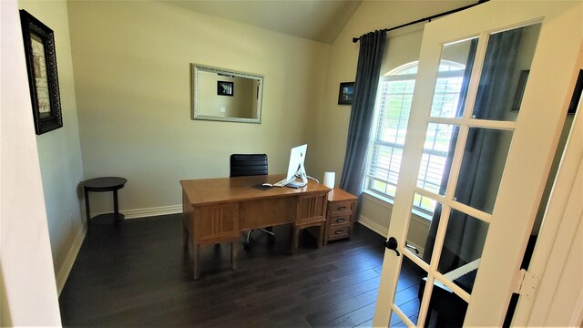 home office featuring lofted ceiling, baseboards, and dark wood-style flooring