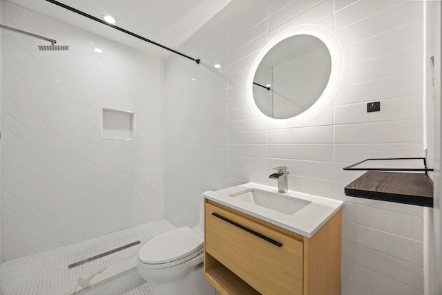 1331 S Denley Dr, Dallas, TX 75216 - full bath featuring tile walls, vanity, tiled shower, and toilet