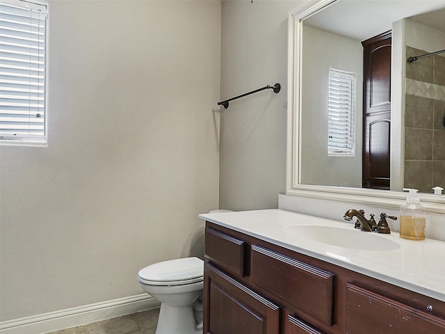 2500 Fountain Cv, Carrollton, TX 75006 - bathroom with walk in shower, vanity, tile patterned floors, baseboards, and toilet