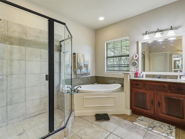 2500 Fountain Cv, Carrollton, TX 75006 - bathroom with a bath, a shower stall, tile patterned floors, vanity, and recessed lighting