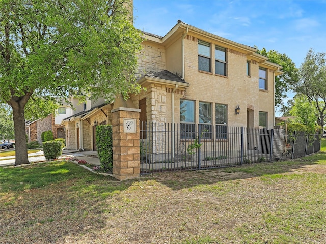 2500 Fountain Cv, Carrollton, TX 75006 - view of front of home featuring fence private yard and stone siding