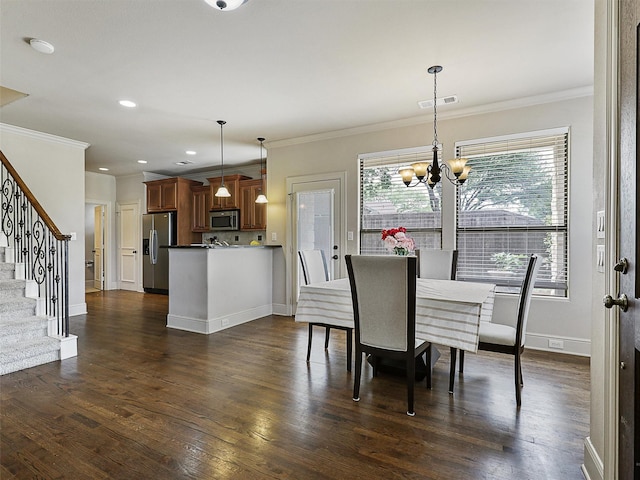 2500 Fountain Cv, Carrollton, TX 75006 - dining area with crown molding, stairs, dark wood-style floors, and an inviting chandelier