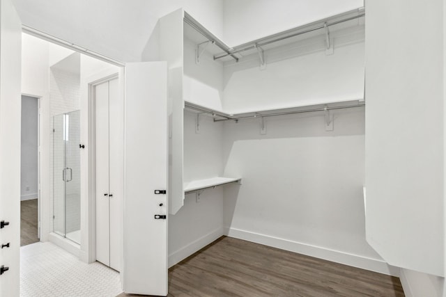 2912 Raleigh St Unit 102, Dallas, TX 75219 - spacious closet featuring dark wood finished floors