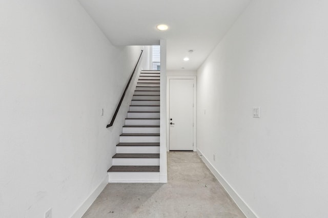 2912 Raleigh St Unit 102, Dallas, TX 75219 - staircase featuring concrete floors, recessed lighting, and baseboards