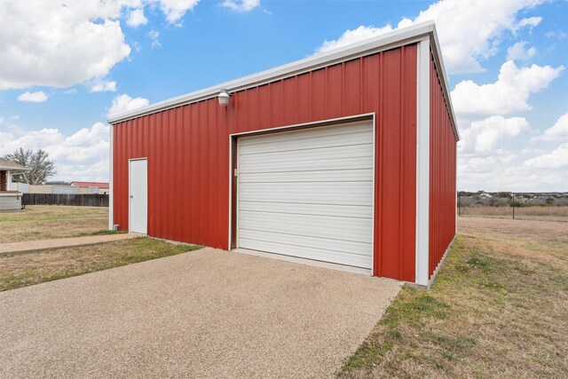 detached garage featuring aphalt driveway
