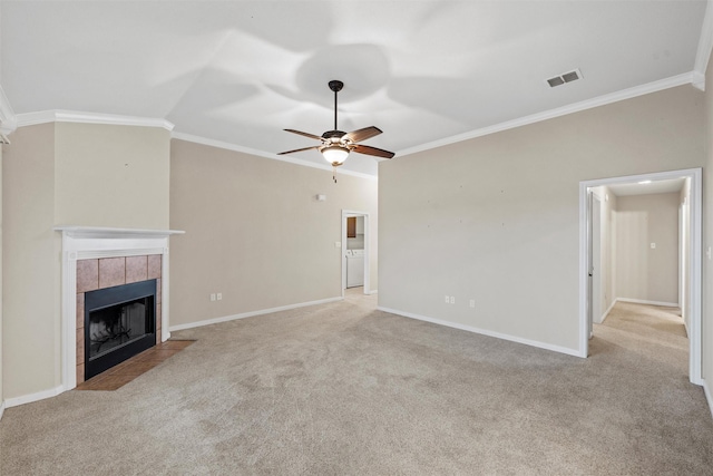 unfurnished living room featuring a fireplace, carpet, ornamental molding, and ceiling fan