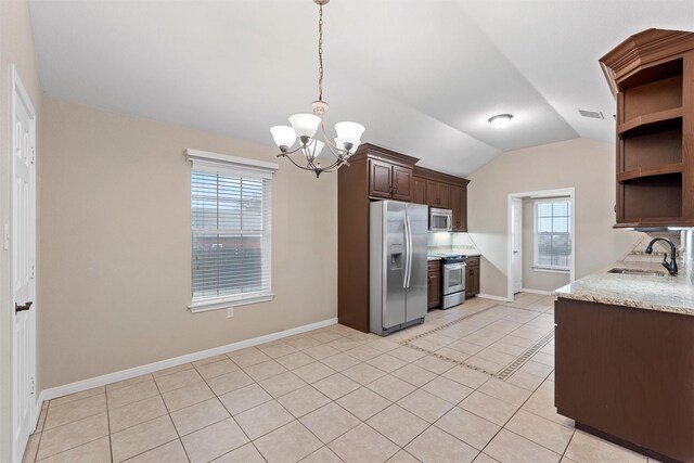 kitchen with dark brown cabinets, open shelves, a sink, an inviting chandelier, and appliances with stainless steel finishes