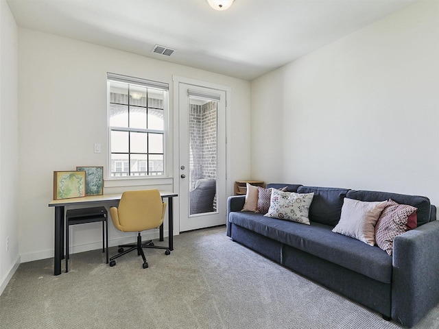 office featuring visible vents, carpet flooring, and baseboards