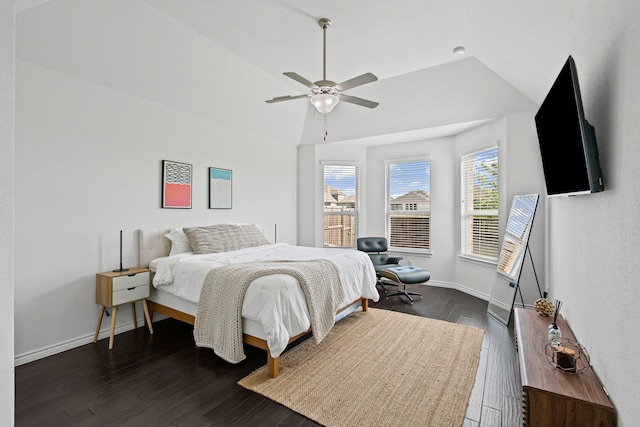 bedroom featuring vaulted ceiling, ceiling fan, baseboards, and dark wood-type flooring