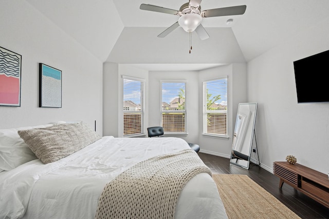 bedroom featuring vaulted ceiling, baseboards, ceiling fan, and dark wood finished floors
