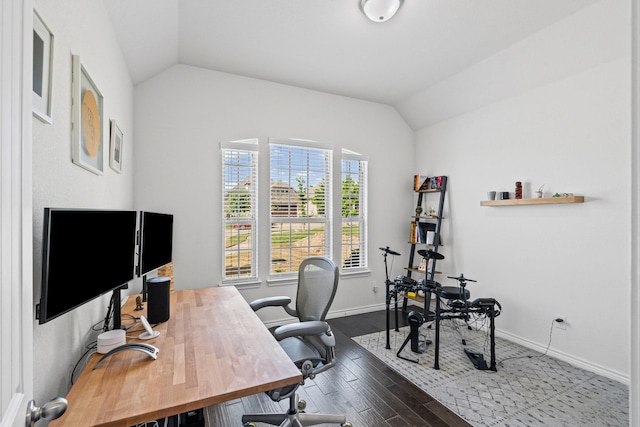 office area with baseboards, vaulted ceiling, and wood finished floors