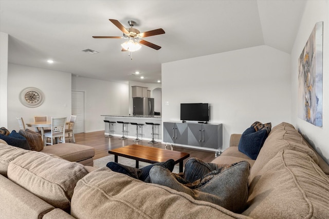 living room featuring wood finished floors, visible vents, recessed lighting, and ceiling fan