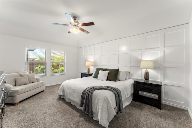 bedroom with carpet floors, a decorative wall, and a ceiling fan