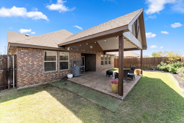 view of patio featuring a fenced backyard and a grill