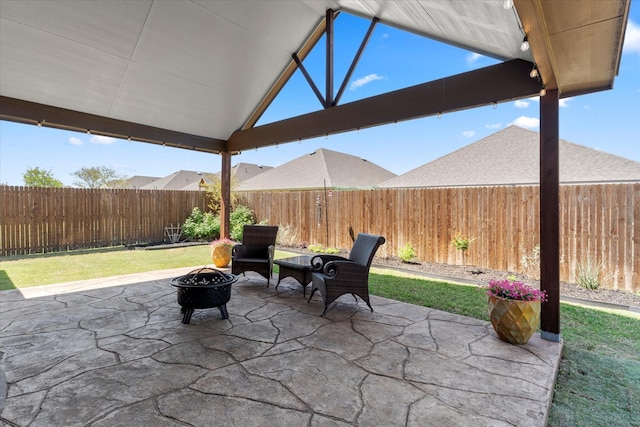view of patio / terrace with a fenced backyard and an outdoor fire pit