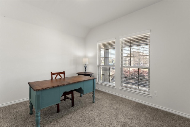 office space with vaulted ceiling, baseboards, and carpet