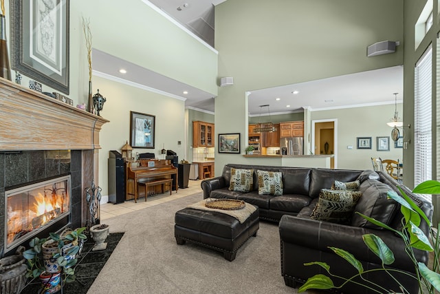 720 Castle Creek Dr, Coppell, TX 75019 - living area with ornamental molding, a high ceiling, a fireplace, light tile patterned floors, and recessed lighting